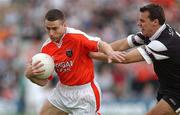 18 August 2002; Diarmuid Marsden of Armagh in action against Nigel Clancy of Sligo during the Bank of Ireland All-Ireland Senior Football Championship Quarter-Final Replay match between Armagh and Sligo at Páirc Tailteann in Navan, Meath. Photo by Brendan Moran/Sportsfile