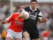 18 August 2002; Dara McGarty of Sligo in action against Aidan O'Rourke of Armagh during the Bank of Ireland All-Ireland Senior Football Championship Quarter-Final Replay match between Armagh and Sligo at Páirc Tailteann in Navan, Meath. Photo by Brendan Moran/Sportsfile