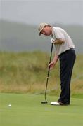 18 August 2002; Philip Walton watches his putt on the 8th green during day two of the North West of Ireland Open at Ballyliffin Golf Club, Glasheby Links, in Donegal. Photo by Matt Browne/Sportsfile