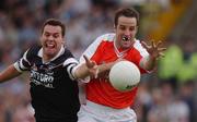 18 August 2002; Barry O'Hagan of Armagh in action against Nigel Clancy of Sligo during the Bank of Ireland All-Ireland Senior Football Championship Quarter-Final Replay match between Armagh and Sligo at Páirc Tailteann in Navan, Meath. Photo by Brendan Moran/Sportsfile
