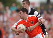 18 August 2002; Ronan Clarke of Armagh in action against Patrick Naughton of Sligo during the Bank of Ireland All-Ireland Senior Football Championship Quarter-Final Replay match between Armagh and Sligo at Páirc Tailteann in Navan, Meath. Photo by Brendan Moran/Sportsfile