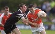 18 August 2002; Oisín McConville of Armagh in action against Noel McGuire of Sligo during the Bank of Ireland All-Ireland Senior Football Championship Quarter-Final Replay match between Armagh and Sligo at Páirc Tailteann in Navan, Meath. Photo by Brendan Moran/Sportsfile