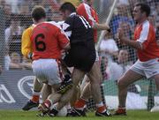 18 August 2002; Sean Davey of Sligo, 11, is blocked by Armagh players Kieran McGeeney, 6, and goalkeeper Brendan Tierney, for which Sligo claimed for a penalty during the Bank of Ireland All-Ireland Senior Football Championship Quarter-Final Replay match between Armagh and Sligo at Páirc Tailteann in Navan, Meath. Photo by Brendan Moran/Sportsfile