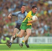 17 August 2002; Brendan Devenney of Donegal is tackled by Paddy Christie of Dublin during the Bank of Ireland All-Ireland Senior Football Championship Quarter-Final Replay match between Dublin and Donegal at Croke Park in Dublin. Photo by Ray McManus/Sportsfile