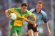 17 August 2002; Christy Toye of Donegal is tackled by Peadar Andrews of Dublin during the Bank of Ireland All-Ireland Senior Football Championship Quarter-Final Replay match between Dublin and Donegal at Croke Park in Dublin. Photo by Ray McManus/Sportsfile