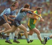 17 August 2002; Adrian Sweeney of Donegal in action against Dublin players, from left, Darren Magee, Coman Goggins and Peader Andrews during the Bank of Ireland All-Ireland Senior Football Championship Quarter-Final Replay match between Dublin and Donegal at Croke Park in Dublin. Photo by Ray McManus/Sportsfile