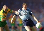 17 August 2002; Coman Goggins of Dublin is tackled by Kevin Cassidy of Donegal during the Bank of Ireland All-Ireland Senior Football Championship Quarter-Final Replay match between Dublin and Donegal at Croke Park in Dublin. Photo by Damien Eagers/Sportsfile