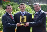 20 August 2002; Sligo footballer Eamonn O'Hara is presented with his Vodafone GAA Player of the Month for July by GAA President Seán McCague, right, and Owen Gibney, Corporate Account Manager, Vodafone, at the Sligo Park Hotel. Photo by Ray McManus/Sportsfile