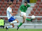 20 August 2002; Jonathan Daly of Republic of Ireland gets past Harri Haapaniemi of Finland to score a goal for his side during the U21 International Friendly match between Finland and Republic of Ireland at Finnair Stadium in Helsinki, Finland. Photo by David Maher/Sportsfile