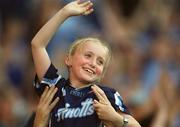 17 August 2002; A young Dublin fan is lifted high above the crowd as she cheers her side on during the Bank of Ireland All-Ireland Senior Football Championship Quarter-Final Replay match between Dublin and Donegal at Croke Park in Dublin. Photo by Damien Eagers/Sportsfile