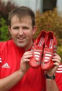 22 August 2002; Cork footballer Colin Corkery in the grounds of Jury's hotel in Cork. Colin is switching from his champagne Adidas predators to Metallic Red/Silver Adidas Predator Mania's for Sunday's Bank of Ireland All-Ireland Senior Football Championship Semi-Final clash with Kerry. Corkery is hoping to raise more money for the childrens Unit of Cork University College Hospital by auctioning the boots after the game. Photo by Damien Eagers/Sportsfile