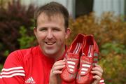 22 August 2002; Cork footballer Colin Corkery in the grounds of Jury's hotel in Cork. Colin is switching from his champagne Adidas predators to Metallic Red/Silver Adidas Predator Mania's for Sunday's Bank of Ireland All-Ireland Senior Football Championship Semi-Final clash with Kerry. Corkery is hoping to raise more money for the childrens Unit of Cork University College Hospital by auctioning the boots after the game. Photo by Damien Eagers/Sportsfile