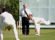 23 August 2002; Stephen Smith of Malahide watched by umpire David Caldwell bowls during the Royal Liver Irish Senior Cricket Cup Final match between Malahide and Rush at Clontarf Cricket Club in Dublin. Photo by David Maher/Sportsfile