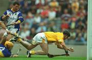 28 July 2002; Gregory O'Kane of Antrim goes past Tipperary goalkeeper Brendan Cummins to score a goal which was subsequently disallowed during the All-Ireland Senior Hurling Championship Quarter-Final match between Antrim and Tipperary at Croke Park in Dublin. Photo by Ray McManus/Sportsfile