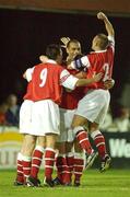 23 August 2002; St Patrick's Athletic players congratulate goalscorer Martin Russell, hidden, after he scored his sides equalising goal during the eircom League Premier Division match between St Patrick's Athletic and Bohemians at Richmond Park in Dublin. Photo by David Maher/Sportsfile