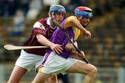 24 August 2002; Diarmuid Lyng of Wexford in action against David Forde of Galway during the All-Ireland U21 Hurling Championship Semi-Final match between Galway and Wexford at Semple Stadium in Thurles, Tipperary. Photo by Damien Eagers/Sportsfile