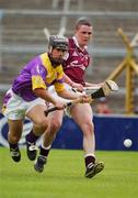 24 August 2002; Tomas Hawkins of Wexford in action against Kevin Brady of Galway during the All-Ireland U21 Hurling Championship Semi-Final match between Galway and Wexford at Semple Stadium in Thurles, Tipperary. Photo by Damien Eagers/Sportsfile