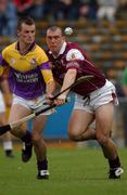 24 August 2002; Darren Stamp of Wexford in action against David Green of Galway during the All-Ireland U21 Hurling Championship Semi-Final match between Galway and Wexford at Semple Stadium in Thurles, Tipperary. Photo by Damien Eagers/Sportsfile
