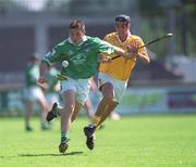 25 August 2002; Eoin Foley of Limerick is tackled by Sean Campbell of Antrim during the All-Ireland U21 Hurling Championship Semi-Final match between Antrim and Limerick at Parnell Park in Dublin. Photo by Aoife Rice/Sportsfile