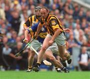 18 August 2002; Andy Comerford of Kilkenny in action against Eddie Enright of Tipperary during the Guinness All-Ireland Senior Hurling Championship Semi-Final match between Kilkenny and Tipperary at Croke Park in Dublin. Photo by Pat Murphy/Sportsfile