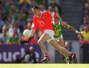 25 August 2002; Jim O'Donoghue of Cork in action against John Sheehan of Kerry during the Bank of Ireland All-Ireland Senior Football Championship Semi-Final match between Kerry and Cork at Croke Park in Dublin. Photo by Damien Eagers/Sportsfile