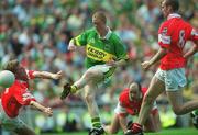 25 August 2002; Colm Cooper of Kerry shoots past Anthony Lynch of Cork, 4, to score his side's second goal during the Bank of Ireland All-Ireland Senior Football Championship Semi-Final match between Kerry and Cork at Croke Park in Dublin. Photo by Damien Eagers/Sportsfile