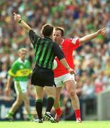 25 August 2002; Colin Corkery of Cork in discussion with referee Brian White during the Bank of Ireland All-Ireland Senior Football Championship Semi-Final match between Kerry and Cork at Croke Park in Dublin. Photo by Ray McManus/Sportsfile