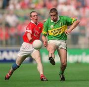 25 August 2002; Darragh Ó Sé of Kerry is tackled by Philip Clifford of Cork during the Bank of Ireland All-Ireland Senior Football Championship Semi-Final match between Kerry and Cork at Croke Park in Dublin. Photo by Damien Eagers/Sportsfile