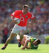 25 August 2002; Joe Kavanagh of Cork races clear of Liam Hassett of Kerry during the Bank of Ireland All-Ireland Senior Football Championship Semi-Final match between Kerry and Cork at Croke Park in Dublin. Photo by Ray McManus/Sportsfile