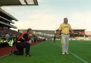 25 August 2002; Cork manager Larry Tompkins and Kerry manager Páidí Ó Sé watch the closing stages of the Bank of Ireland All-Ireland Senior Football Championship Semi-Final match between Kerry and Cork at Croke Park in Dublin. Photo by Damien Eagers/Sportsfile