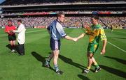 17 August 2002; Dublin captain Coman Goggins shakes hands with Donegal captain Michael Hegarty as referee Pat McEnaney Gives instruction to one of his umpires prior to the Bank of Ireland All-Ireland Senior Football Championship Quarter-Final Replay match between Dublin and Donegal at Croke Park in Dublin. Photo by Ray McManus/Sportsfile