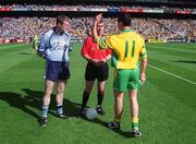 17 August 2002; Having won the toss Donegal captain Michael Hegarty indicates which way his side will play to Dublin captain Coman Goggins and referee Pat McEnaney prior to the Bank of Ireland All-Ireland Senior Football Championship Quarter-Final Replay match between Dublin and Donegal at Croke Park in Dublin. Photo by Ray McManus/Sportsfile