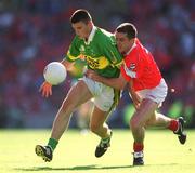 25 August 2002; Aodán Mac Gearailt of Kerry is tackled by Martin Cronin of Cork during the Bank of Ireland All-Ireland Senior Football Championship Semi-Final match between Kerry and Cork at Croke Park in Dublin. Photo by Ray McManus/Sportsfile