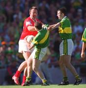 25 August 2002; Colin Corkery of Cork tussles with Séamus Moynihan of Kerry, as his team-mate Michael McCarthy, right, attempts to intervene, during the Bank of Ireland All-Ireland Senior Football Championship Semi-Final match between Kerry and Cork at Croke Park in Dublin. Photo by Damien Eagers/Sportsfile