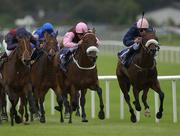24 August 2002; Runners and riders, from left, Zady, with Johnny Murtagh up, in a pink cap and brown silks, with Iron Lad, with Pat Smullen up, in a pink hat and blue silks, during the Tattersalls Breeders Stakes at The Curragh Racecourse in Kildare. Photo by Matt Browne/Sportsfile