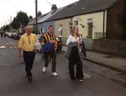 18 August 2002; Supporters make their way to Croke Park through a residental area ahead of the Guinness All-Ireland Senior Hurling Championship Semi-Final match between Kilkenny and Tipperary at Croke Park in Dublin. Photo by Ray McManus/Sportsfile