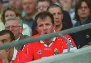 25 August 2002; Colin Corkery of Cork watches the game from the stands after he was sent off by referee Brian White during the Bank of Ireland All-Ireland Senior Football Championship Semi-Final match between Kerry and Cork at Croke Park in Dublin. Photo by Damien Eagers/Sportsfile