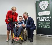 22 August 2017; Tánaiste Frances Fitzgerald TD, left, and FAI Chief Executive John Delaney, right, look at the Football For All booklet with James Casserly, aged 11, from Lucan, Co. Dublin during the Football For All Strategic Plan Launch at the Marker Hotel in Dublin. Photo by David Fitzgerald/Sportsfile