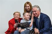 22 August 2017; Tánaiste Frances Fitzgerald TD, left, and FAI Chief Executive John Delaney, right, look at the Football For All booklet with James Casserly, aged 11, from Lucan, Co. Dublin and his mother Vicky Casserly during the Football For All Strategic Plan Launch at the Marker Hotel in Dublin. Photo by David Fitzgerald/Sportsfile