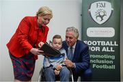 22 August 2017; Tánaiste Frances Fitzgerald TD, left, and FAI Chief Executive John Delaney, right, look at the Football For All booklet with James Casserly, age 11, from Lucan, Co. Dublin during the Football For All Strategic Plan Launch at the Marker Hotel in Dublin.  Photo by Cody Glenn/Sportsfile