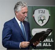 22 August 2017; FAI Chief Executive John Delaney reads the Football For All Strategic Plan booklet during the Football For All Strategic Plan Launch at the Marker Hotel in Dublin.  Photo by Cody Glenn/Sportsfile