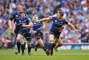 19 May 2012; Brian O'Driscoll, Leinster, passes to team-mate Sean O'Brien, as he is tackled by Pedrie Wannenburg, Ulster. Heineken Cup Final, Leinster v Ulster, Twickenham Stadium, Twickenham, England. Picture credit: Diarmuid Greene / SPORTSFILE