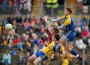 20 May 2012; Roscommon goalkeeper Geoffrey Claffey punches the ball out from Paul Conroy, Galway, and team-mate Niall Carty. Connacht GAA Football Senior Championship Quarter-Final, Roscommon v Galway, Dr. Hyde Park, Roscommon. Picture credit: Barry Cregg / SPORTSFILE