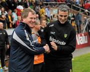 20 May 2012; Donegal manager Jim McGuinness, right, shakes hands with Terry Hyland, Cavan manager, after the game. Ulster GAA Football Senior Championship Preliminary Round, Cavan v Donegal, Kingspan Breffni Park, Cavan. Picture credit: Oliver McVeigh / SPORTSFILE
