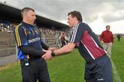 20 May 2012; Roscommon manager Des Newton, left, shakes hands with Galway manager Alan Mulholland after the game. Connacht GAA Football Senior Championship Quarter-Final, Roscommon v Galway, Dr. Hyde Park, Roscommon. Picture credit: Barry Cregg / SPORTSFILE