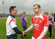 20 May 2012; Louth manager Peter Fitzpatrick shakes hands with captain Paddy Keenan after the game. Leinster GAA Football Senior Championship, Westmeath v Louth, Pairc Tailteann, Navan, Co. Meath. Photo by Sportsfile