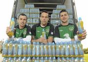 21 May 2012; The Republic of Ireland football team load up on Lucozade Sport ahead of their travels to Italy, Hungary and Poland. The team will consume over 7000 bottles of Lucozade Sport, nearly 4,000 litres, the official sports drink of the FAI, on their road to the finals. Pictured are Republic of Ireland players Keith Fahey, left, David Forde and Shane Long, right. Republic of Ireland Lucozade Sport Photocall, Portmarnock Hotel, Dublin. Photo by Sportsfile