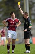 20 May 2012; Mark Hehir, Galway receives a yellow card from referee Joe Mcquillan. Connacht GAA Football Senior Championship Quarter-Final, Roscommon v Galway, Dr. Hyde Park, Roscommon. Picture credit: Barry Cregg / SPORTSFILE