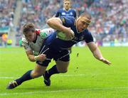 19 May 2012; Heinke Van Der Merwe goes over to score his side's fourth try despite the tackle of Craig Gilroy, Ulster. Heineken Cup Final, Leinster v Ulster, Twickenham Stadium, Twickenham, England. Picture credit: Tom Dwyer / SPORTSFILE
