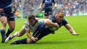 19 May 2012; Heinke Van Der Merwe goes over to score his side's fourth try despite the tackle of Craig Gilroy, Ulster. Heineken Cup Final, Leinster v Ulster, Twickenham Stadium, Twickenham, England. Picture credit: Tom Dwyer / SPORTSFILE